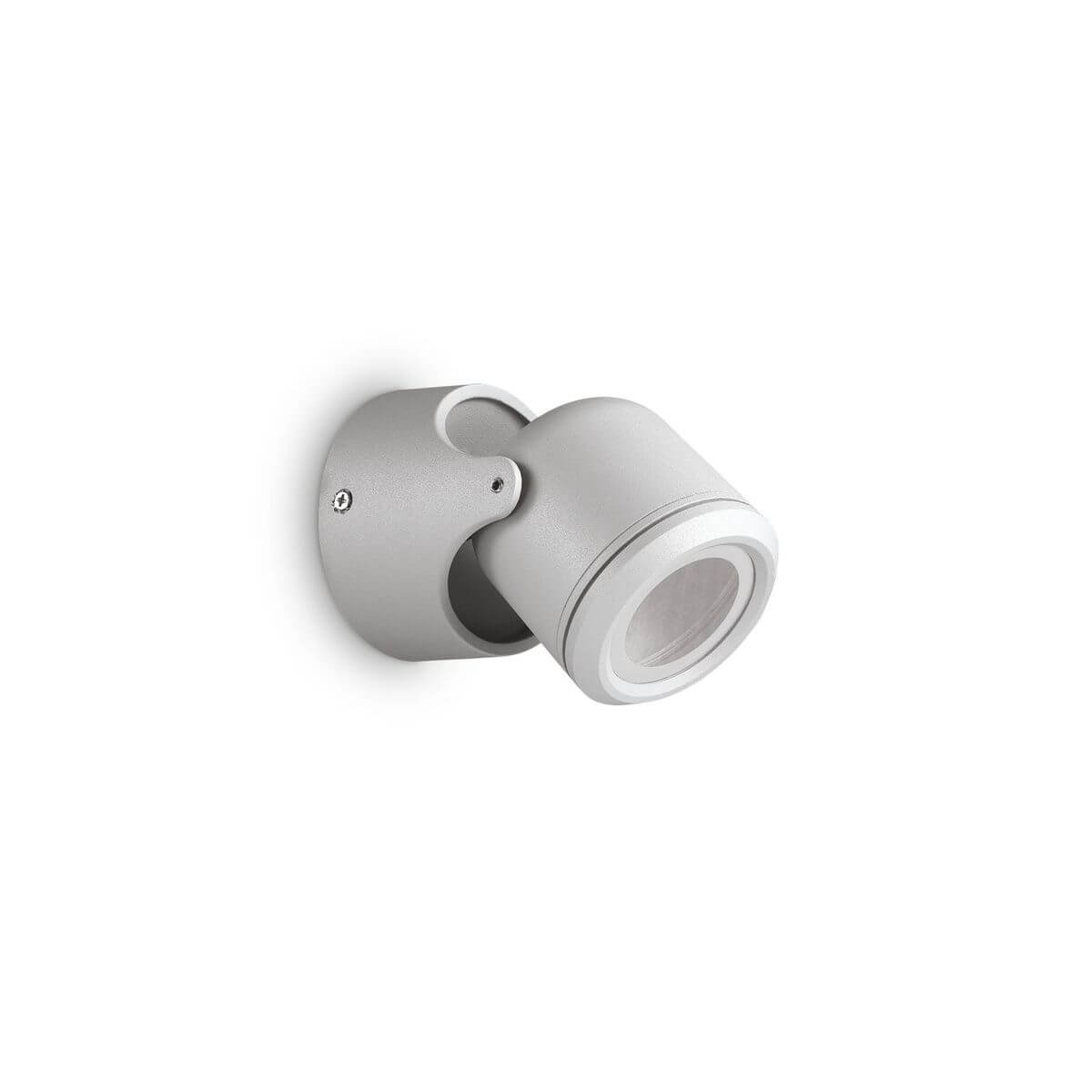 Applique extérieure grise orientable, corps cylindrique et hublot en verre vu de trois quarts