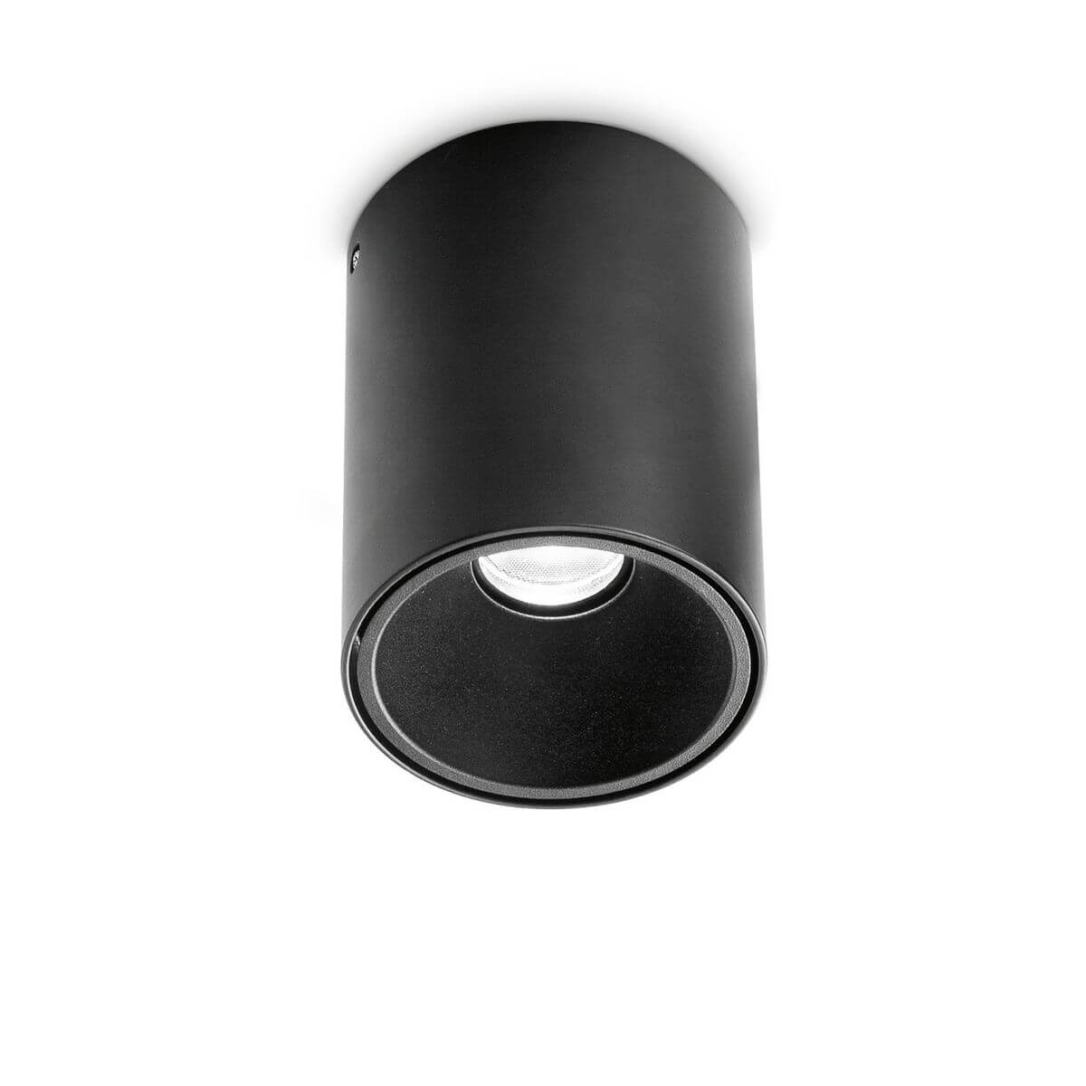 Plafonnier cylindrique noir mat, spot orientable vu de face sur fond blanc