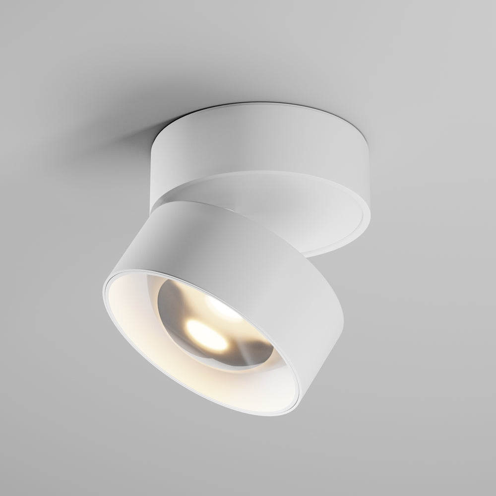 Vue de face du plafonnier blanc orientable, cylindre incliné et allumé