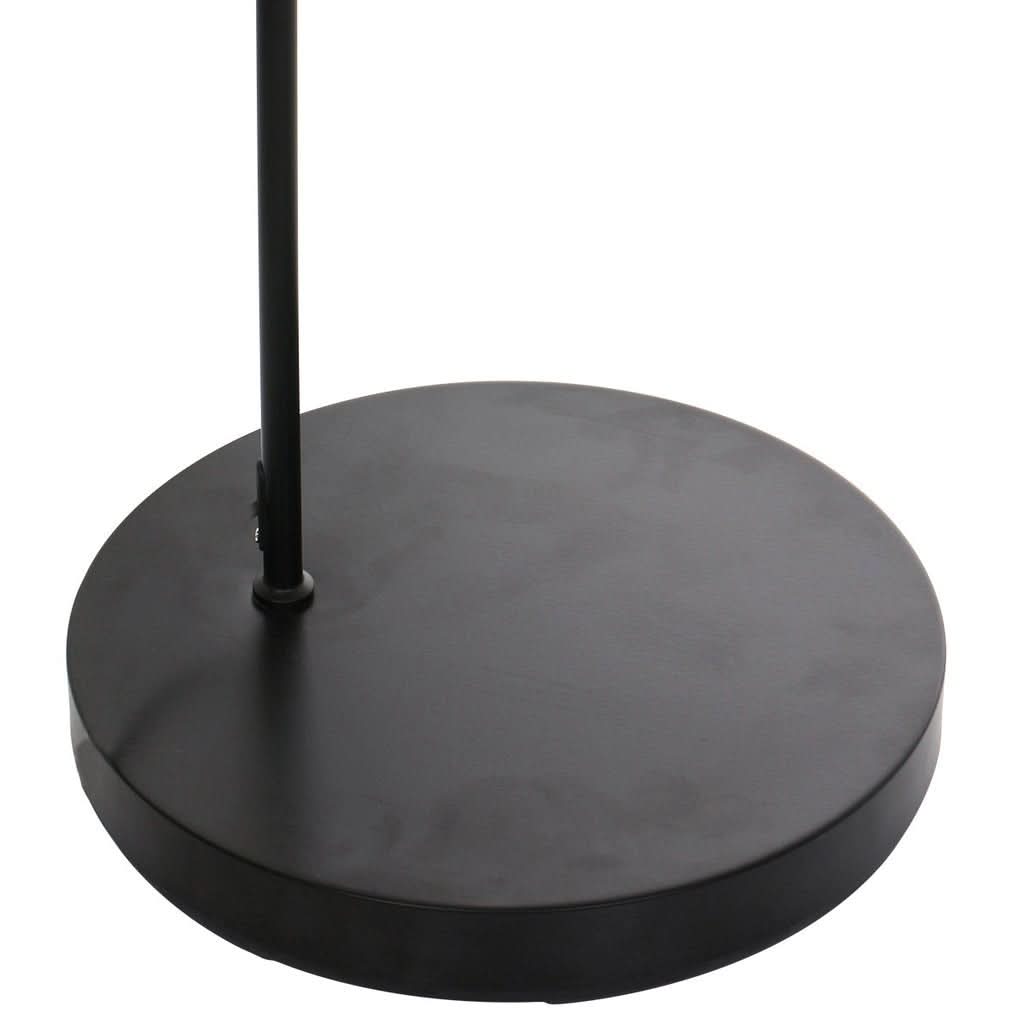 Gros plan de la base ronde noire et du bas du pied vertical