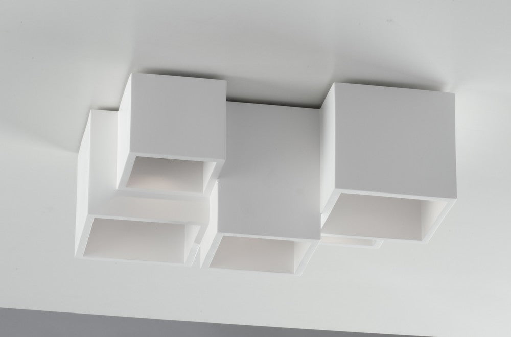 Angle rapproché révélant la finition mate blanche et les reflets internes des cubes