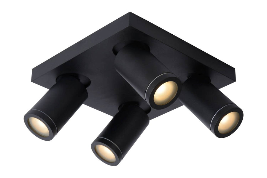Photo produit sur fond blanc du plafonnier noir et de ses quatre projecteurs cylindriques allumés.