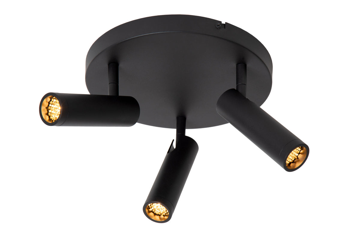 Spot plafond noir trois lumières allumées, orientables vers le bas sur fond blanc