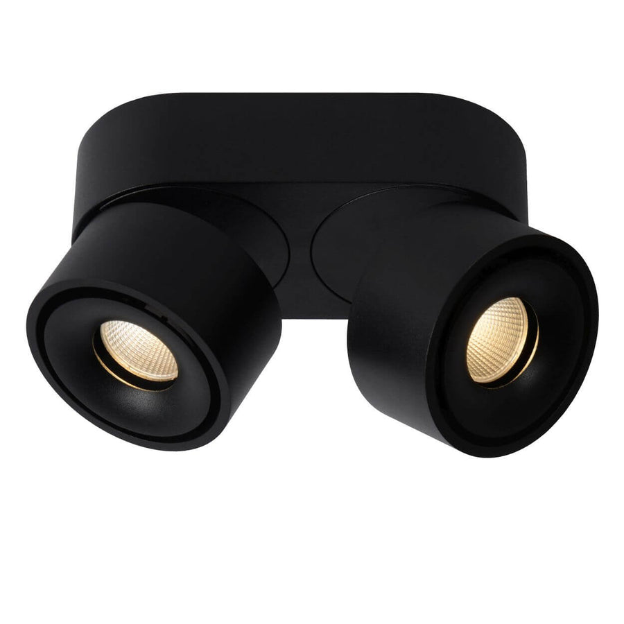 Produit de trois quarts sur fond blanc, réflecteurs dorés visibles dans les deux spots