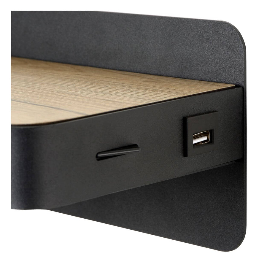 Détail rapproché du port USB et de l'interrupteur sur le chant noir