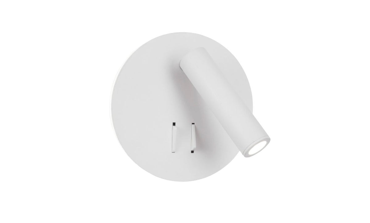 Vue de face du luminaire blanc, socle circulaire et tête cylindrique inclinée sur la droite