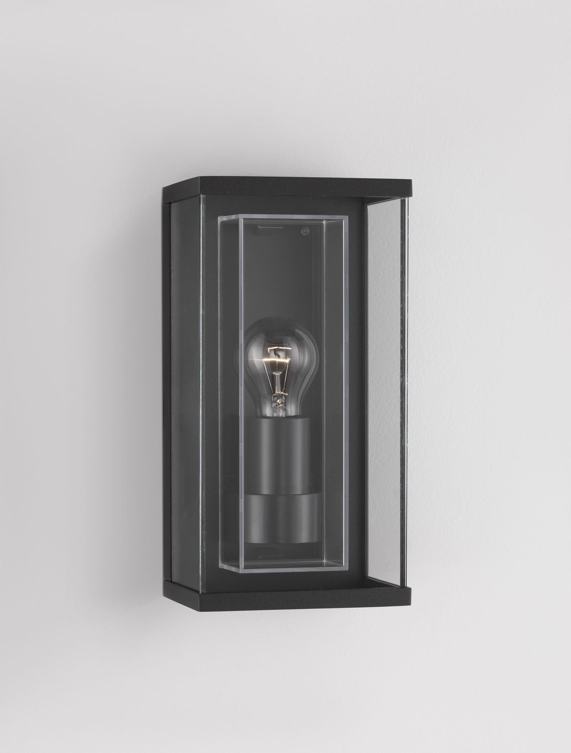 Luminaire allumé de face, ampoule à filament chaude dans le boîtier vitré