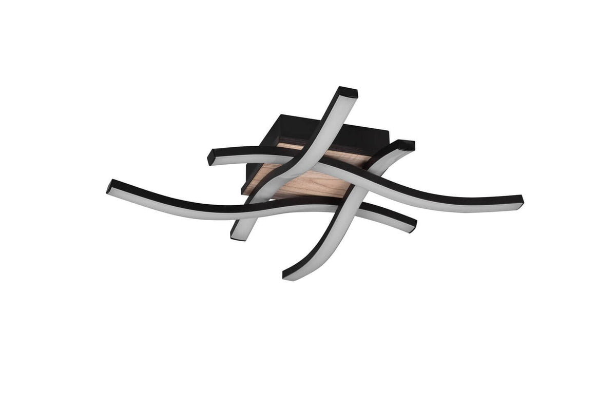 Profil du luminaire noir aux bras sinueux laissant apparaître la lumière blanche.