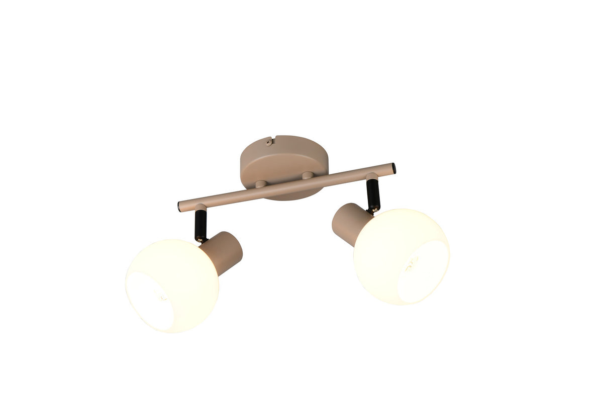 Vue rapprochée du plafonnier beige, deux diffuseurs sphériques allumés et orientation ajustable.