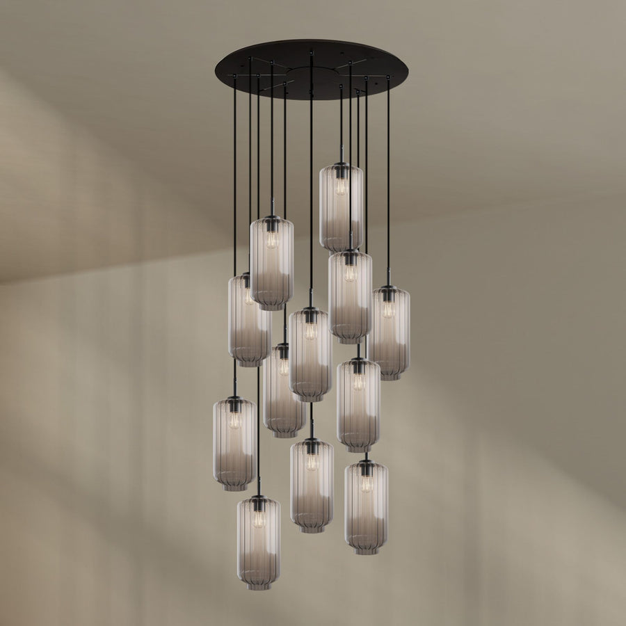 Variante en verre gris clair dégradé, douze suspensions cylindriques de face sur fond beige