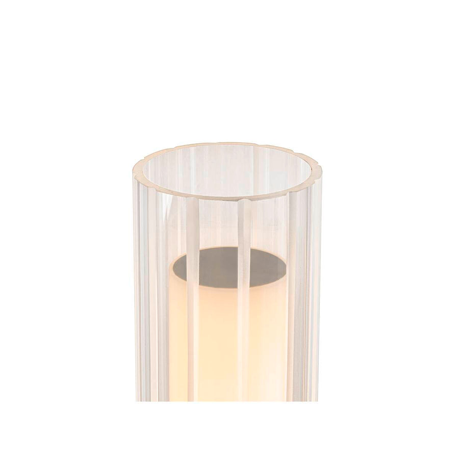 Détail du haut du cylindre en verre strié laissant voir l’ampoule chaude.