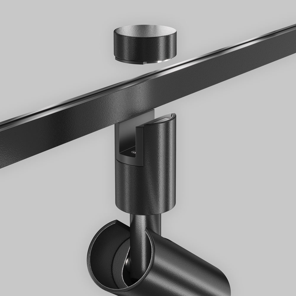 Détail du raccord sur rail, articulation réglable et finition martelée noire