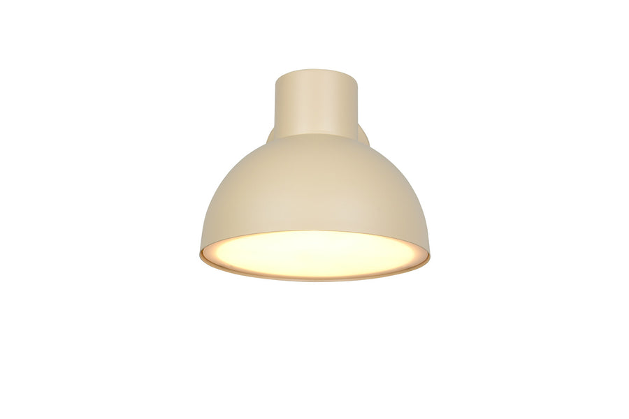 Vue de dessous de l'applique allumée, abat-jour bombé et col cylindrique beige.