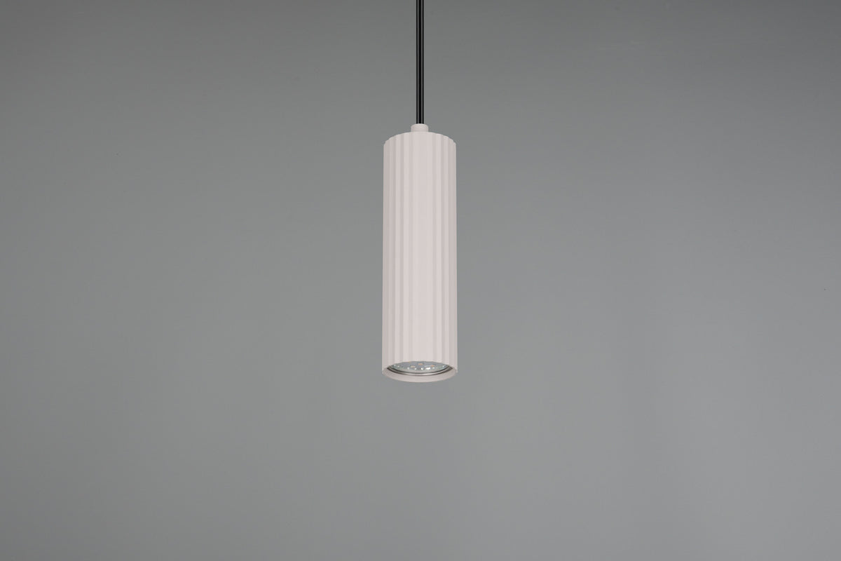 Gros plan sur le bas du cylindre blanc et sa grille diffuseur, fond gris