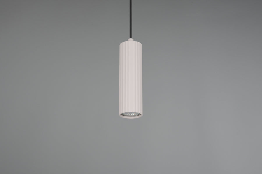 Gros plan sur le bas du cylindre blanc et sa grille diffuseur, fond gris