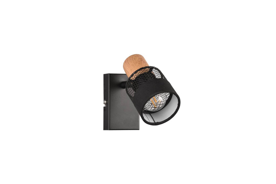 Gros plan sur l'ampoule du spot noir mat, détail de la finition et de la grille.