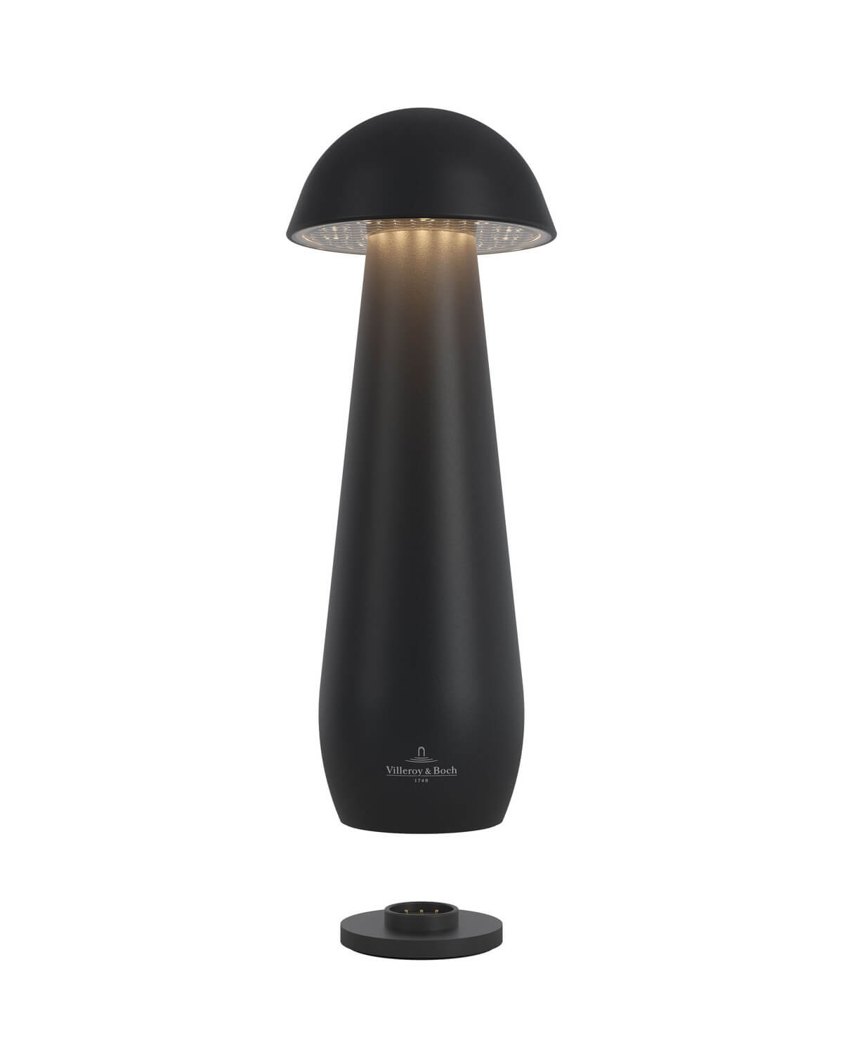 Lampe noire allumée vue de dessous avec base de recharge séparée.
