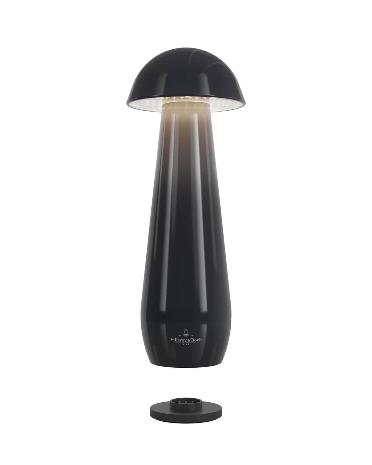 Luminaire allumé au-dessus de sa base de recharge noire, sur fond blanc.