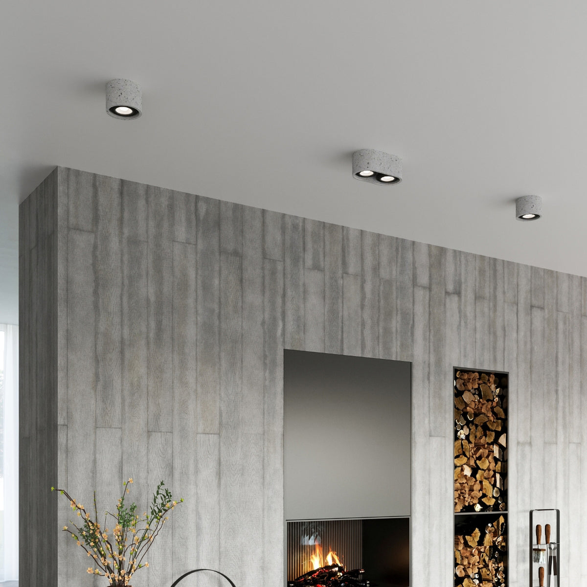 Mise en ambiance : plafonniers béton installés au plafond d'un intérieur.