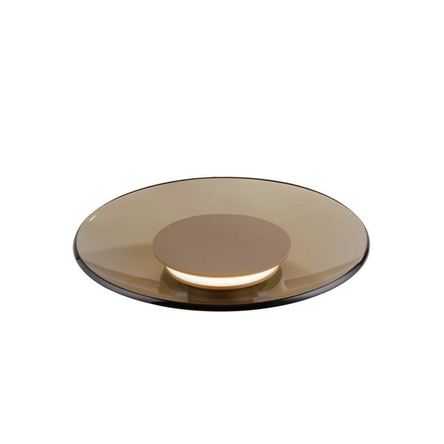 Vue de dessus du disque en verre ambré, montrant la base centrale et le bord transparent.