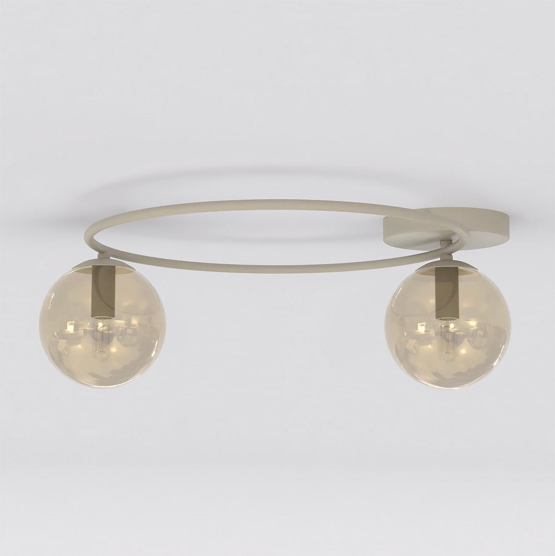 Vue de face du luminaire, deux globes en verre ambré et armature beige