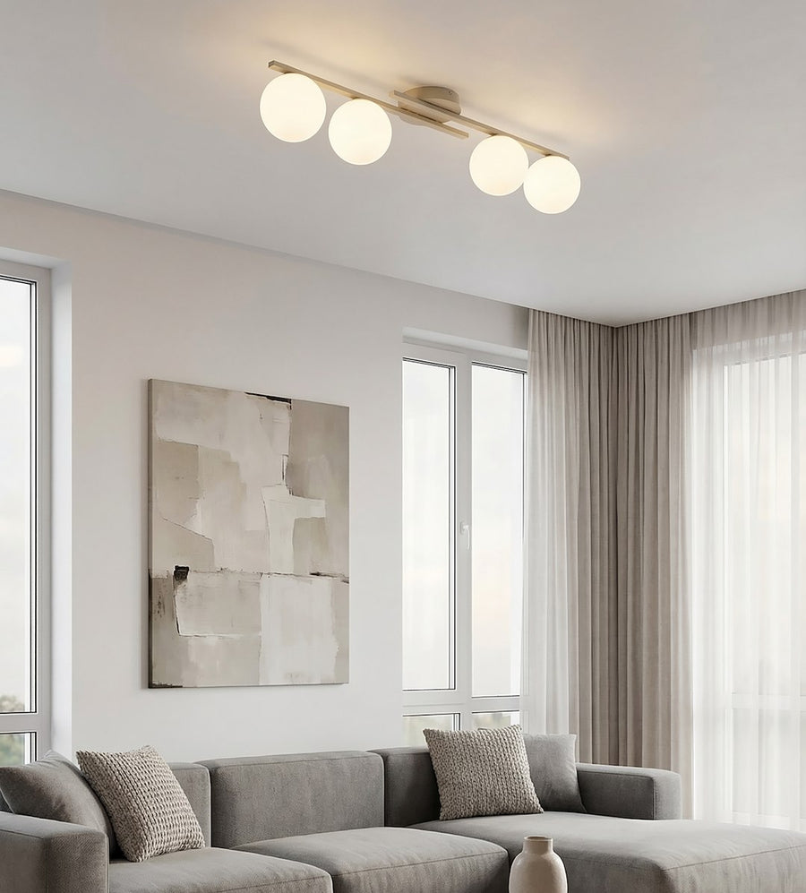 Plafonnier beige allumé au-dessus d'un canapé dans un salon contemporain