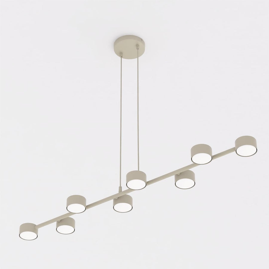 Vue de face du luminaire beige à huit spots cylindriques alignés.
