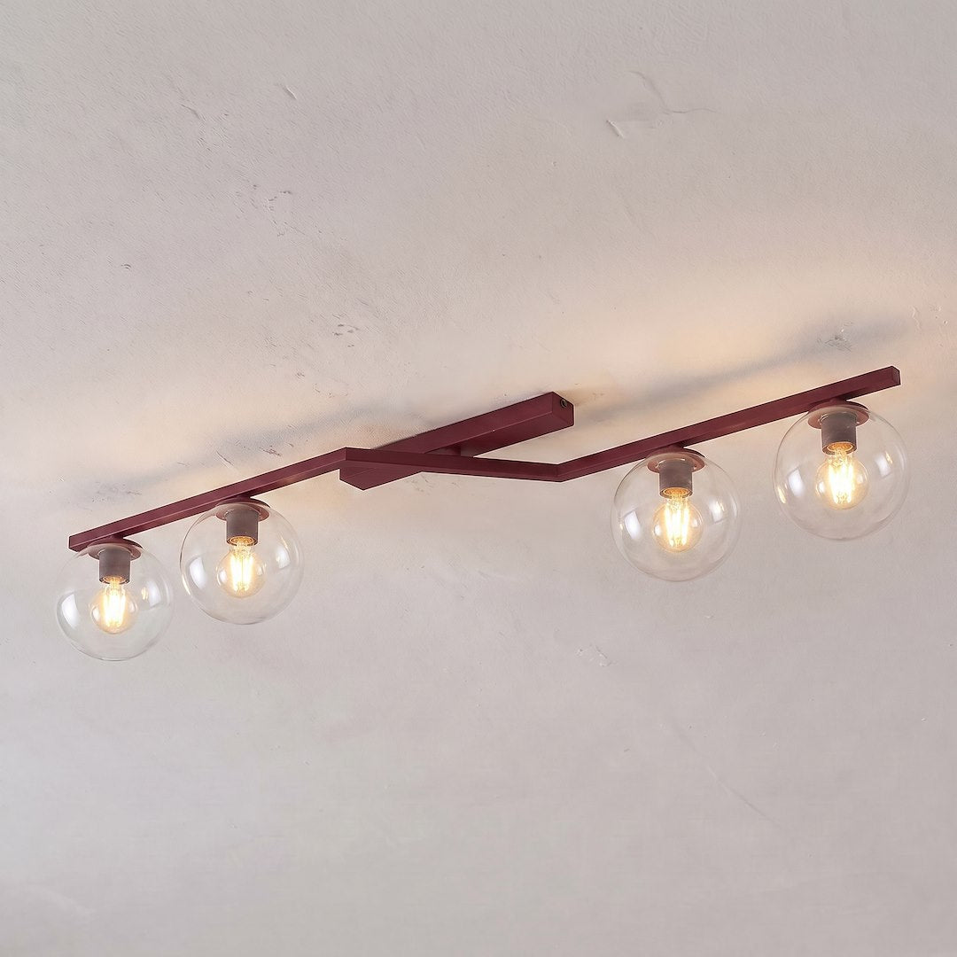 Luminaire fixé au plafond d'une pièce claire, ampoules allumées et halos lumineux