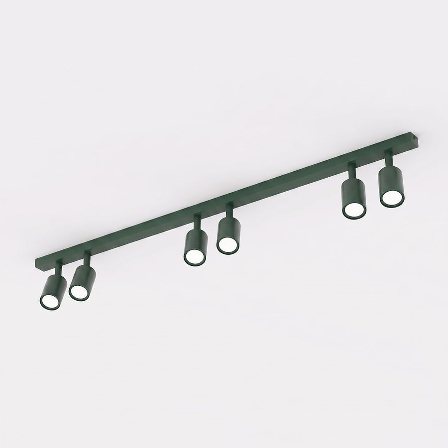 Plafonnier vert à six projecteurs cylindriques orientables sur rail linéaire, vue de face
