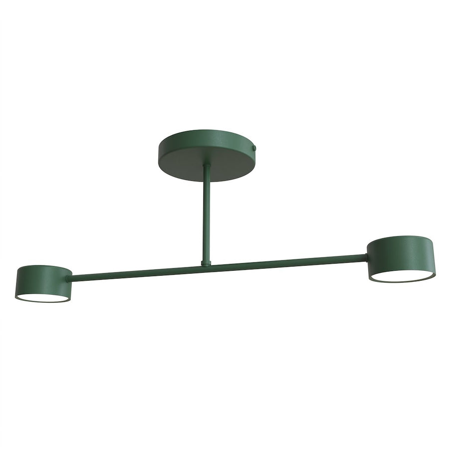 Luminaire vert de face sur fond blanc, bras horizontal et deux diffuseurs cylindriques.