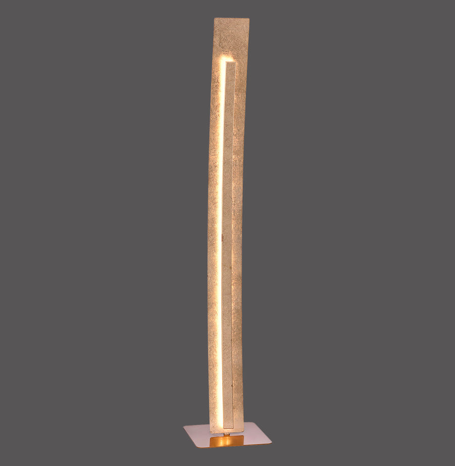 Lampadaire doré vertical allumé, vue de face sur fond gris anthracite.