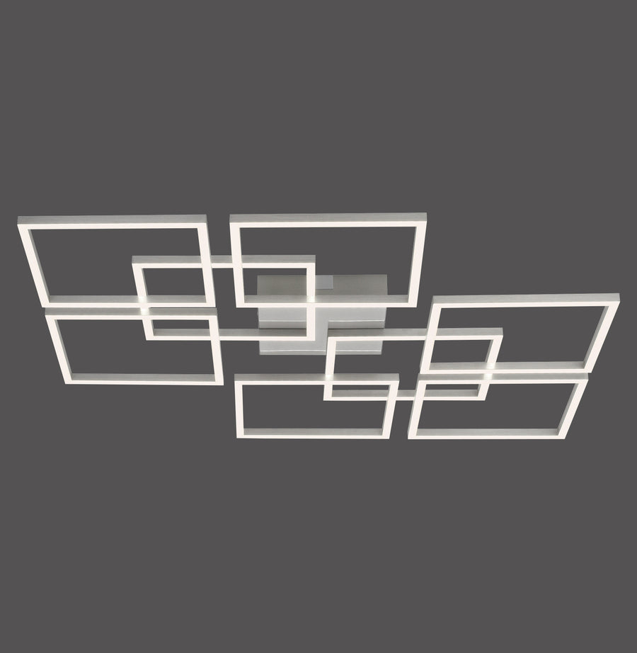 Plafonnier géométrique composé de cadres rectangulaires imbriqués en acier, sur fond gris.