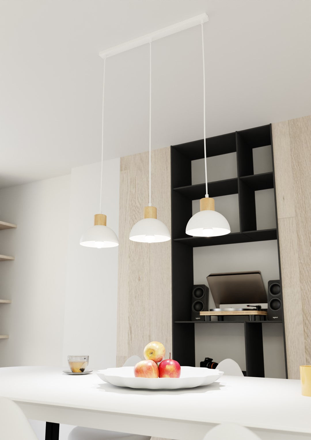 Mise en ambiance au-dessus d'une table blanche devant une bibliothèque noire et bois.