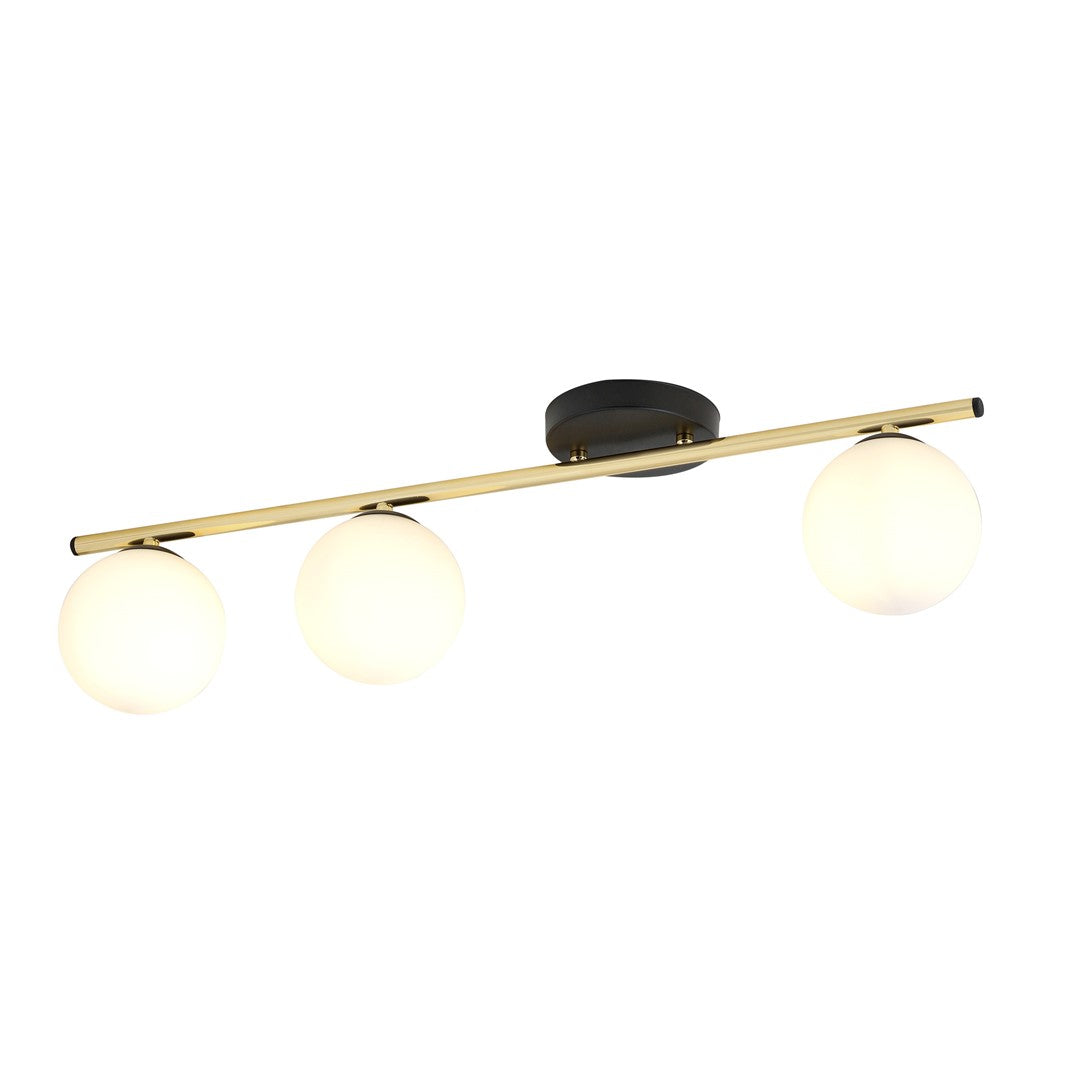Même luminaire allumé, globes diffusant une lumière chaude et uniforme