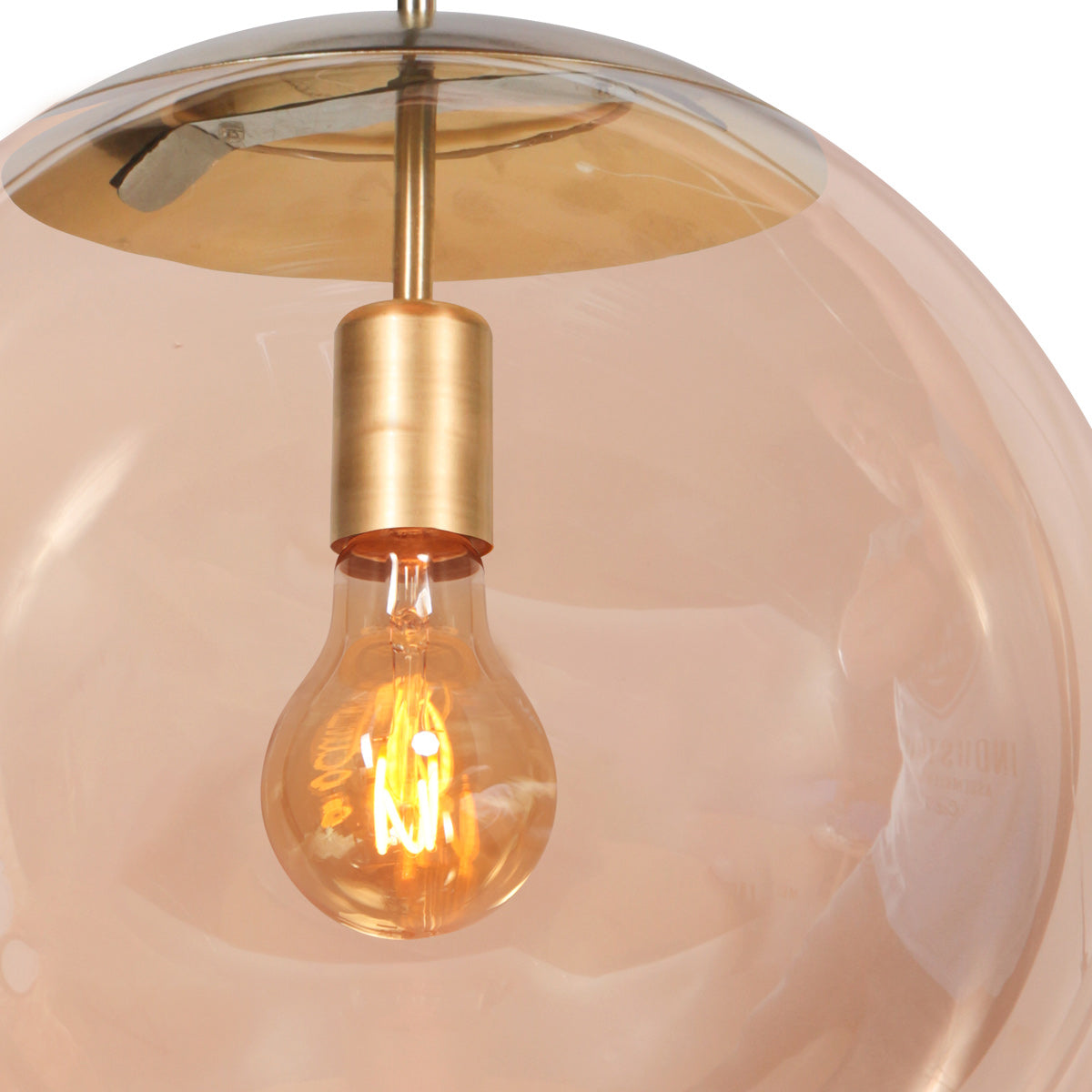 Suspension globe verre ambré Bollique allumée, lumière chaude E27