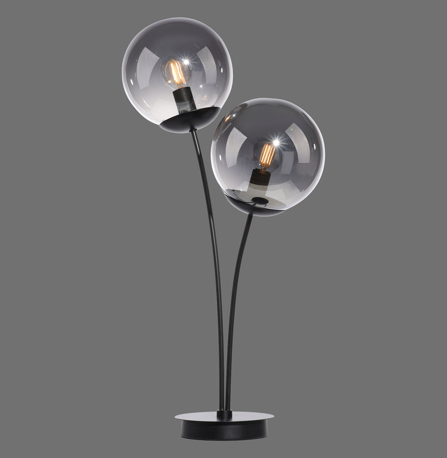 Lampe à poser noire à deux globes en verre fumé, vue de face sur fond gris