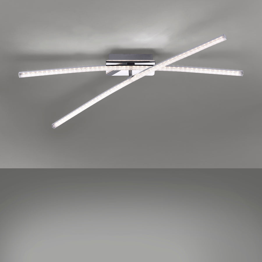 Luminaire allumé sur fond gris, diffusant une lumière homogène dans la pièce