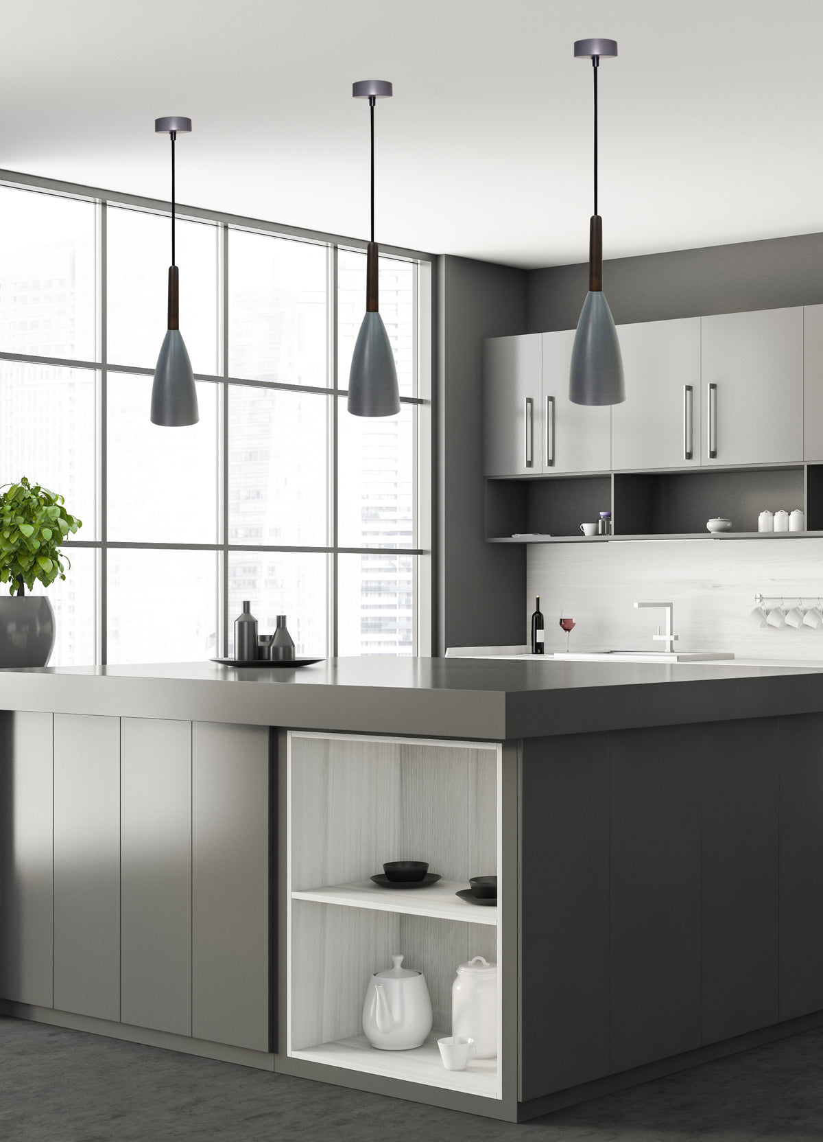 Mise en ambiance cuisine moderne avec trois suspensions alignées au-dessus de l'îlot central