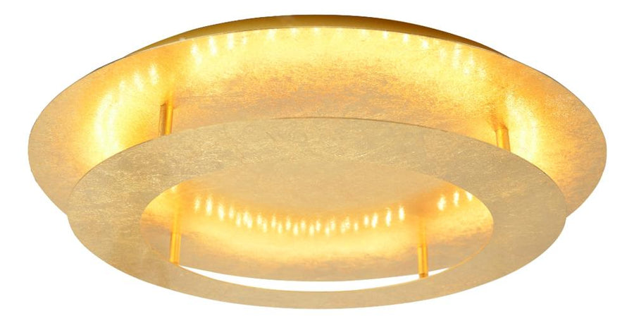 Version dorée allumée diffusant une lumière chaude sous l'anneau extérieur.