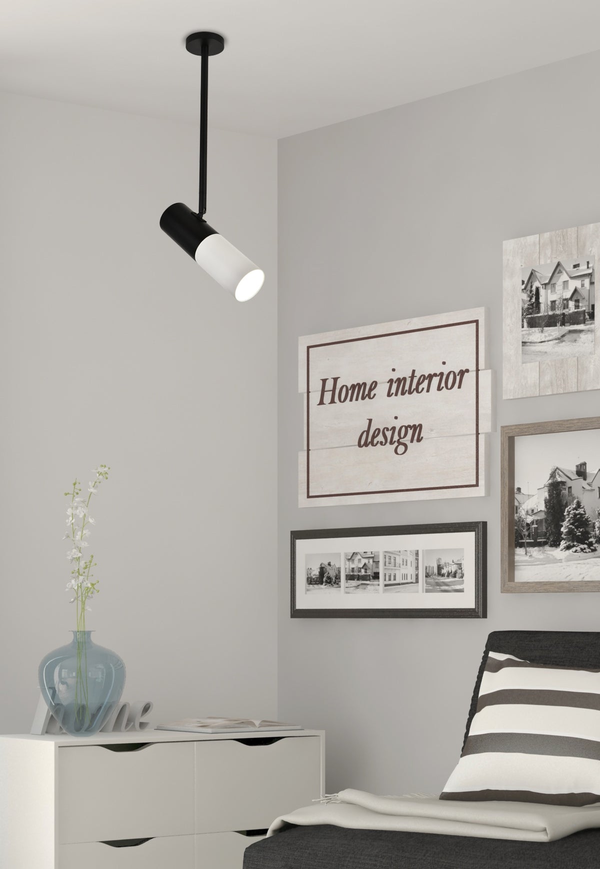 Mise en ambiance dans une chambre grise avec cadres, vase et commode blanche