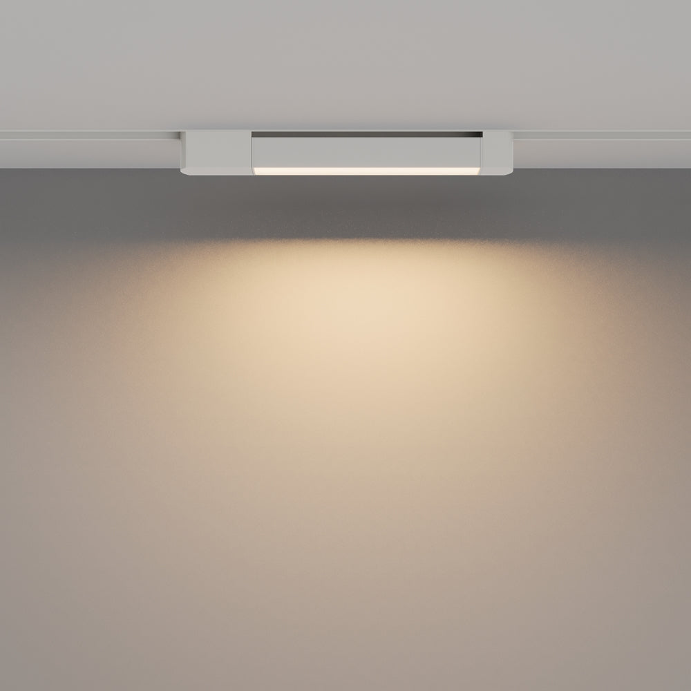 Vue de face montrant le halo lumineux chaud projeté sur le mur