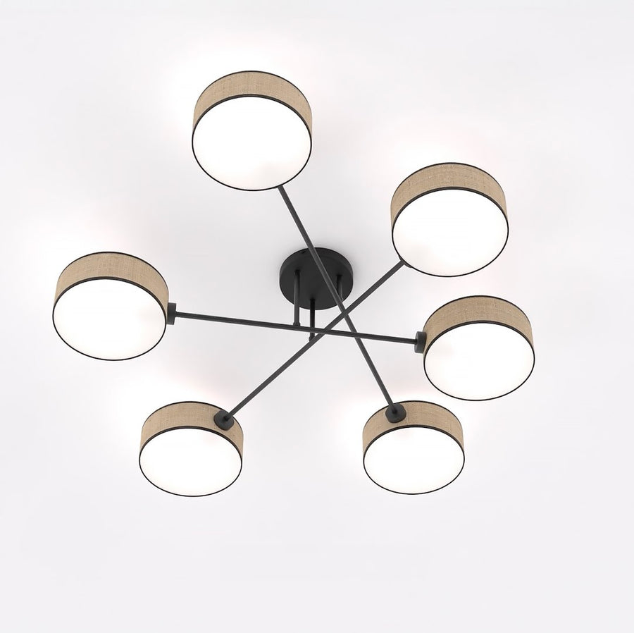 Vue de dessous du luminaire montrant la structure métallique noire en croix et six diffuseurs