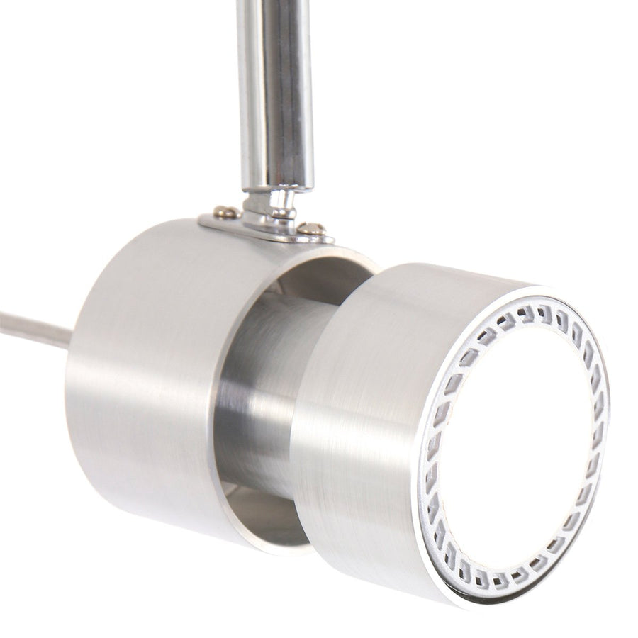 Gros plan sur la tête cylindrique d'un spot, lentille LED circulaire et bord ajouré.