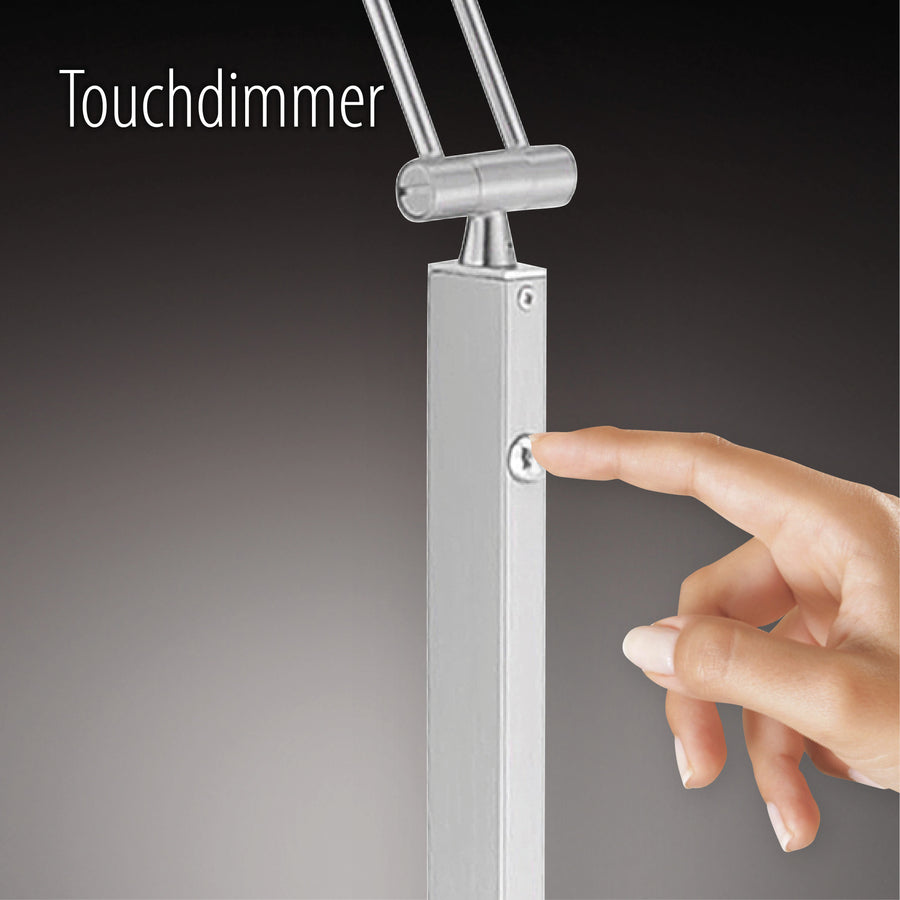 Gros plan d'un doigt actionnant le variateur tactile sur le montant du luminaire