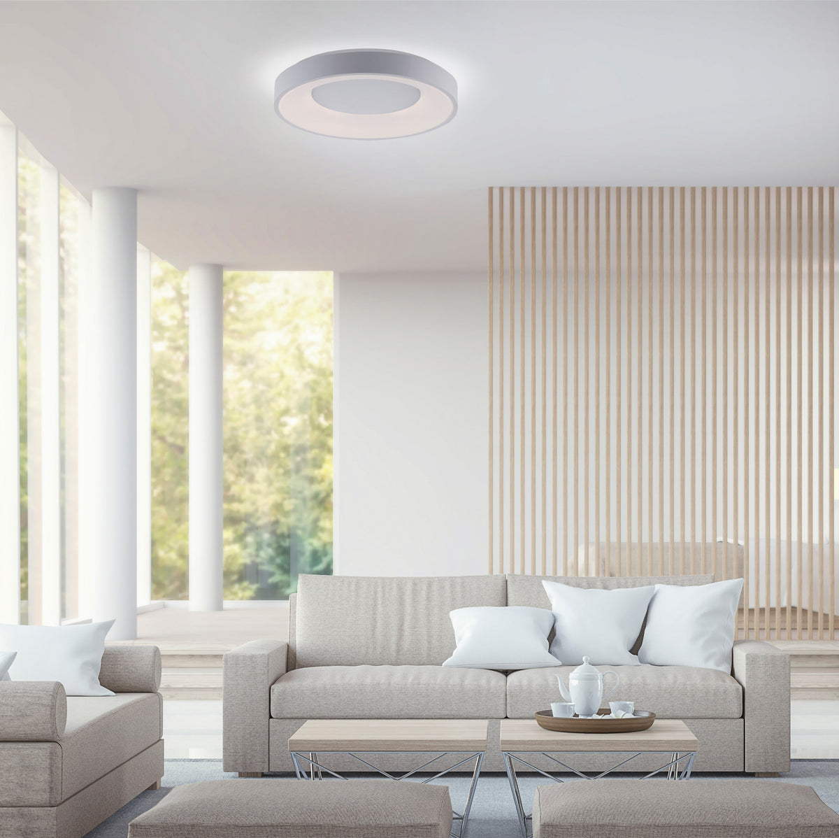 Mise en ambiance salon moderne, plafonnier blanc fixé au plafond au-dessus du canapé
