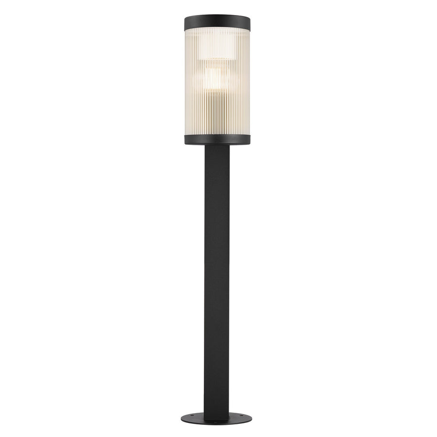 Vue de face du luminaire, diffuseur cylindrique dans l'axe du mât noir