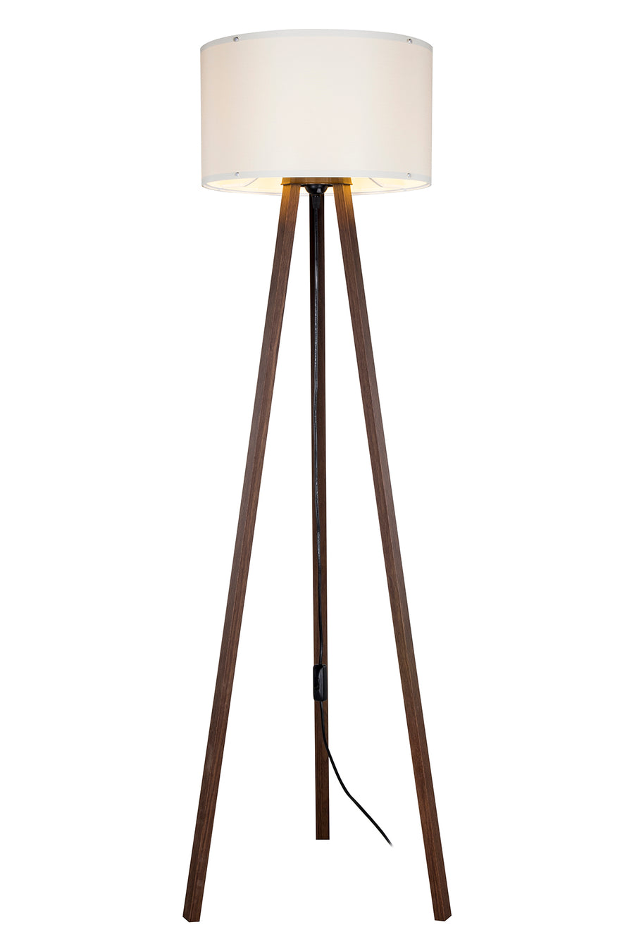 Lampadaire allumé, l'abat-jour diffusant une lumière chaude sur le trépied
