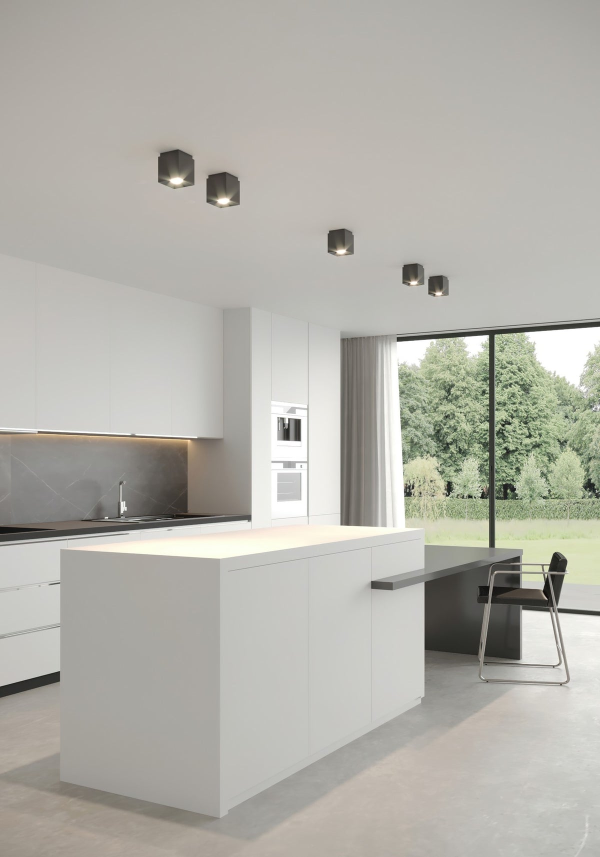 Mise en ambiance dans une cuisine moderne avec plusieurs spots noirs au plafond.