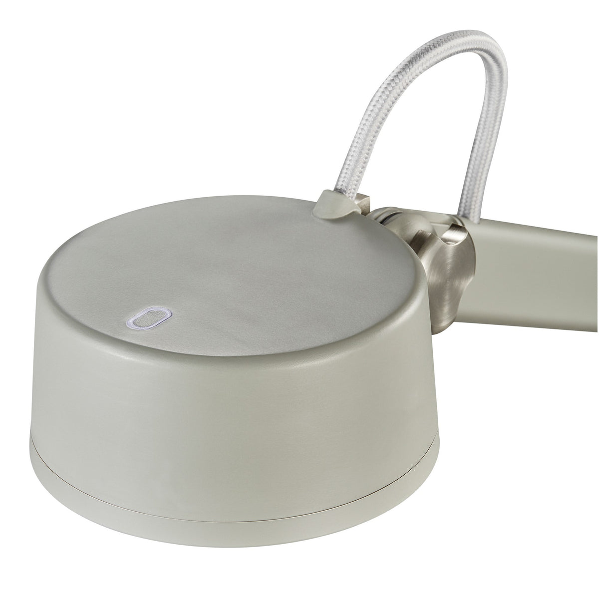 Détail de la tête cylindrique avec interrupteur tactile et finition mate.