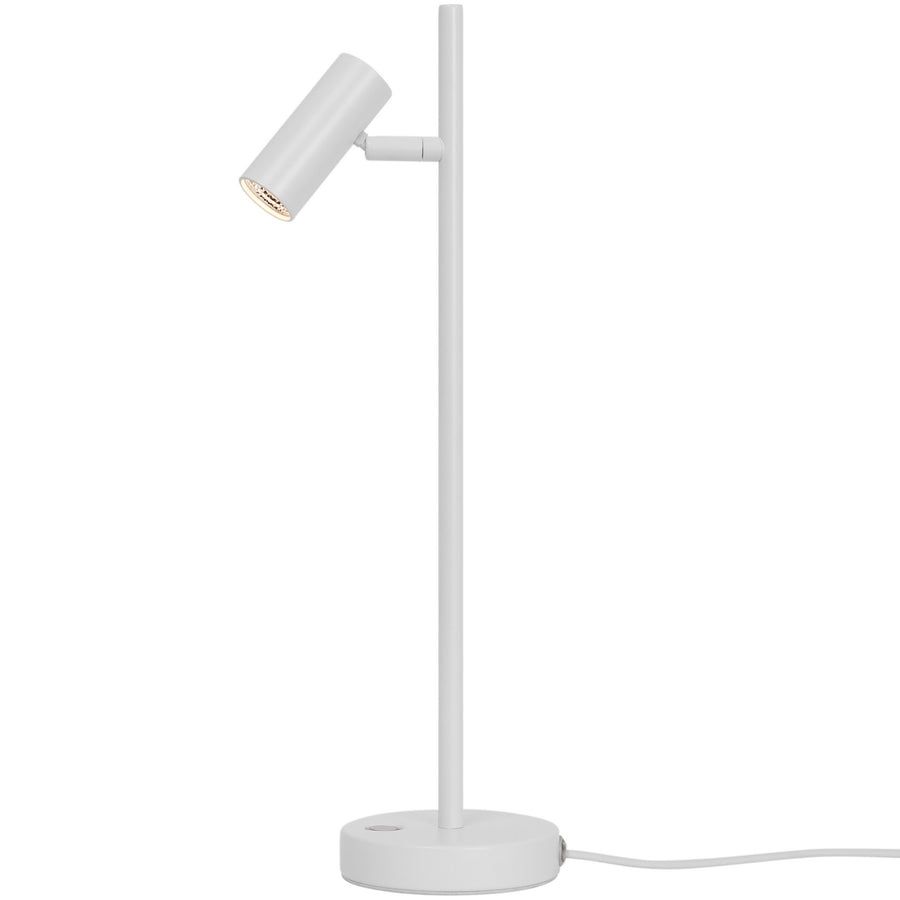 Lampe blanche de profil, tête cylindrique orientable et tige verticale sur socle rond.